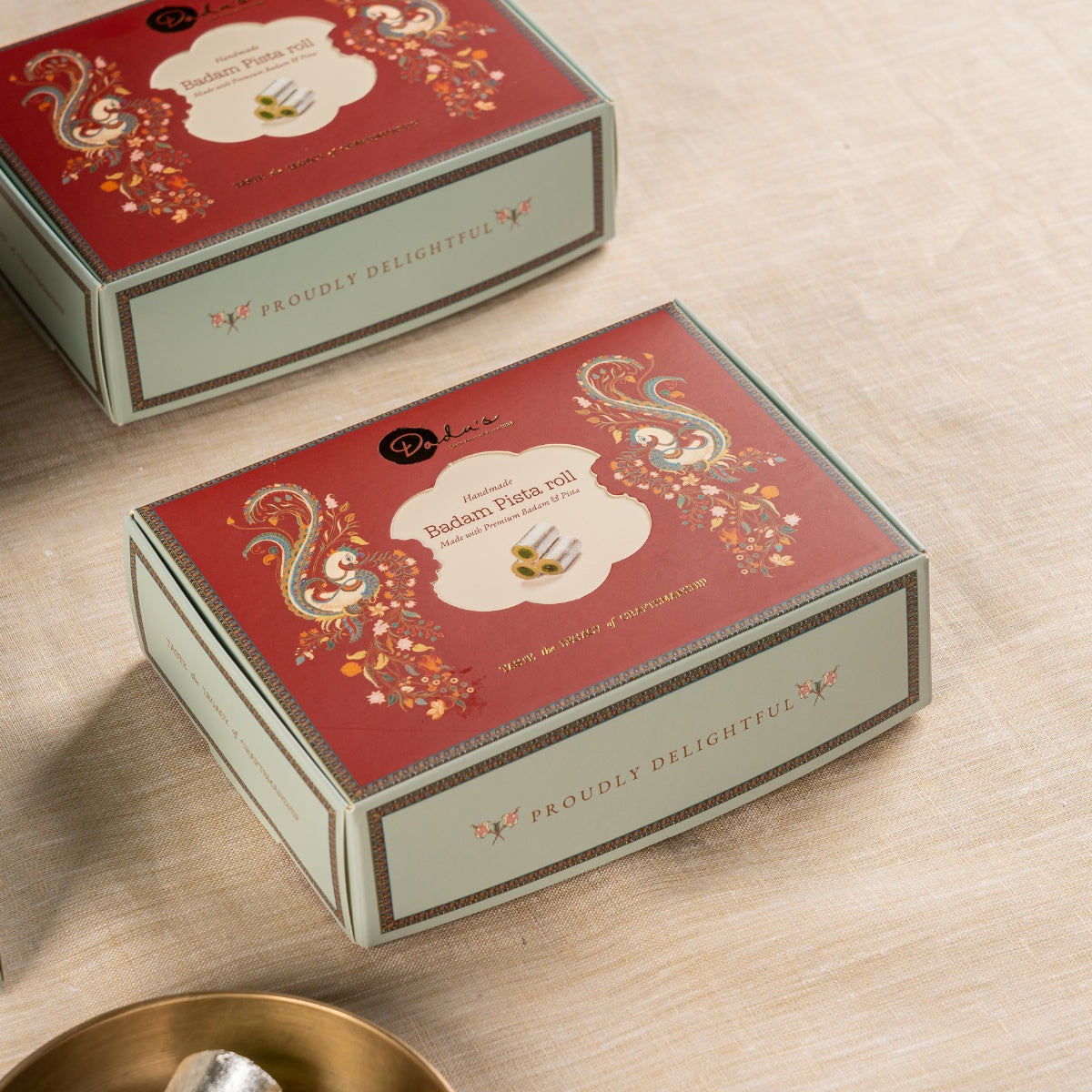 Dadu's Badam Pista Roll in branded gift packaging
